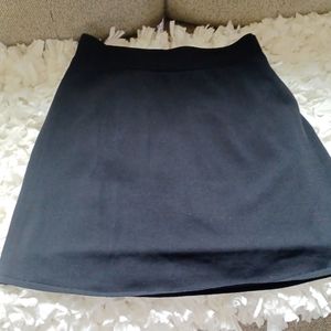 Jet black stretch mini skirt with slip.And elastic  waist.excellent condition